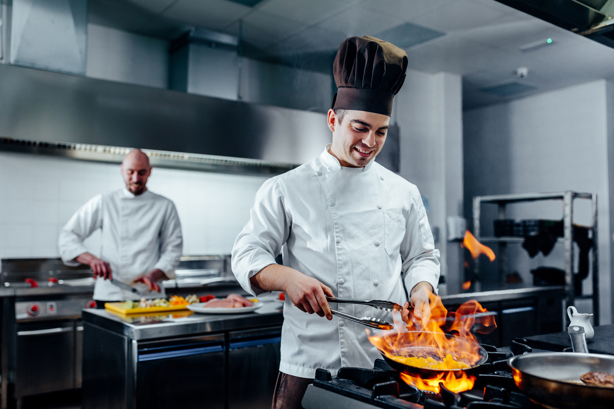 man cooks in a restaurant