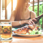 woman dines outside during summer