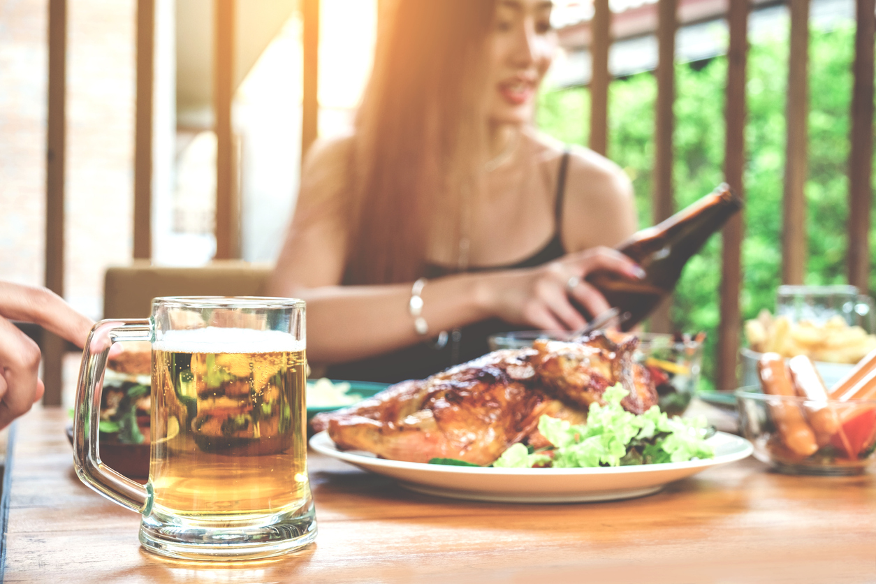 woman dines outside during summer