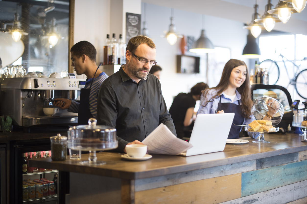 man in restautant tracking utility bills