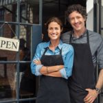 couple standing in restaurant doorway