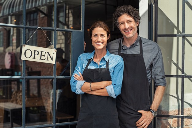 couple standing in restaurant doorway