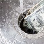 washing money down the drain